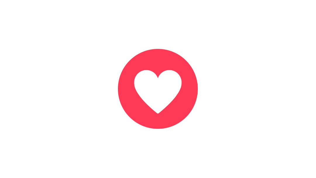 Ein roter Kreis mit einem weißen Herzsymbol in der Mitte vor einem schlichten weißen Hintergrund.
